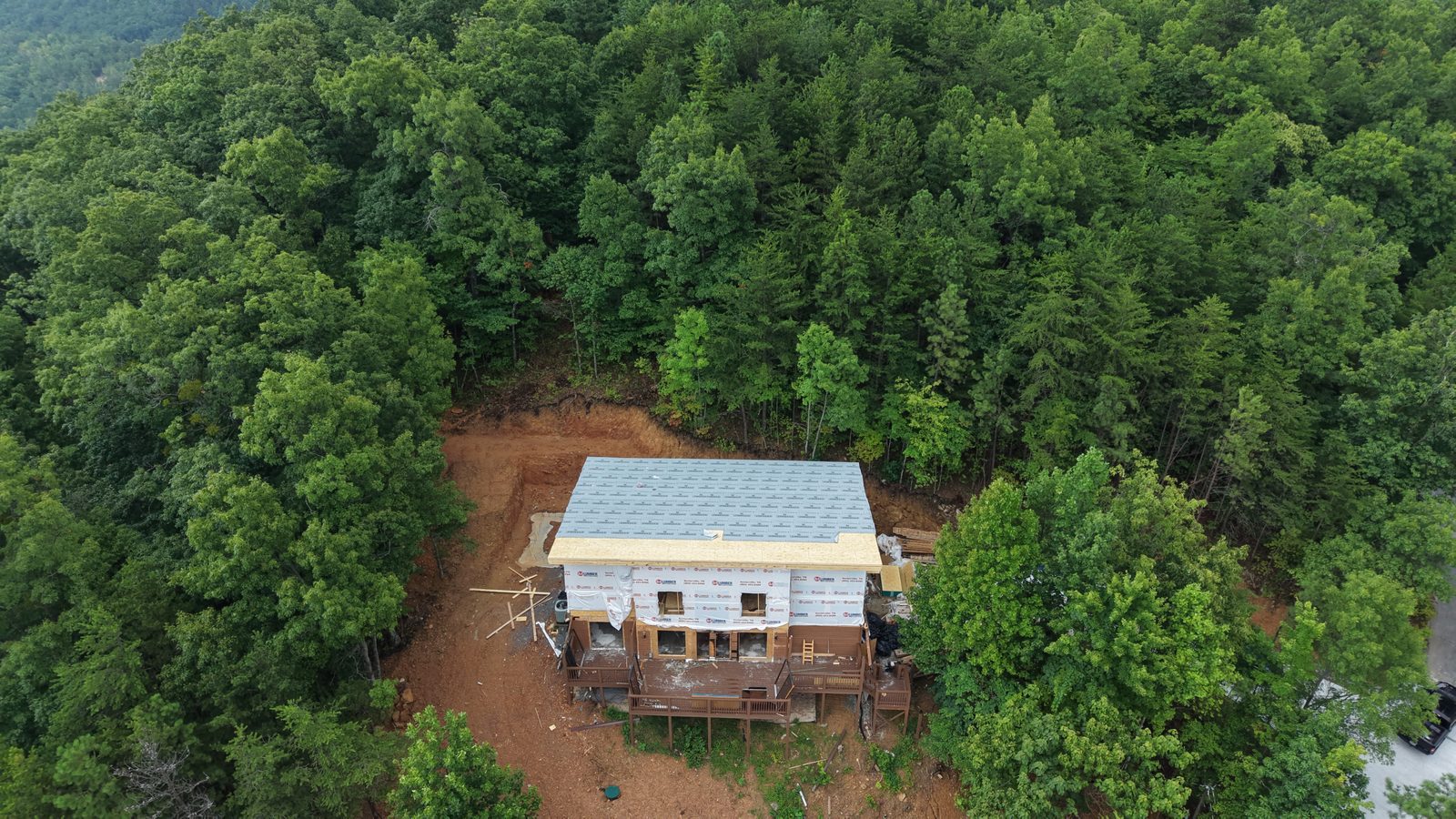 Aerial view of house wrapped and framed
