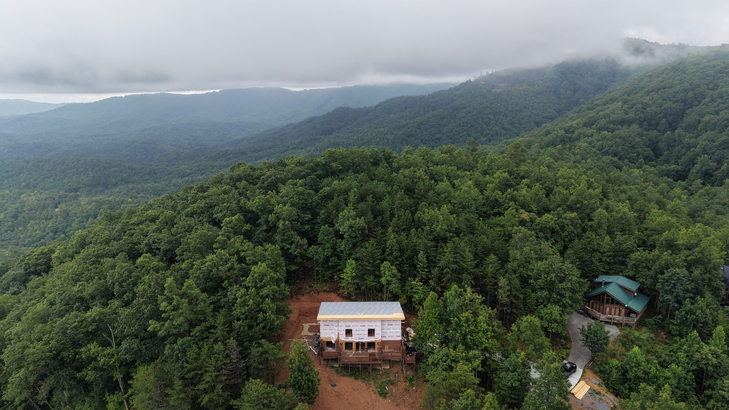Aerial view of The Misty Pine and the fog-covered Smoky Mountains